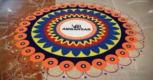 kamalnishad.com RANGOLI ART – DIWALI RANGOLI 2023 at VR AMBARSAR MALL by ARTIST KAMAL NISHAD_ ORANGE